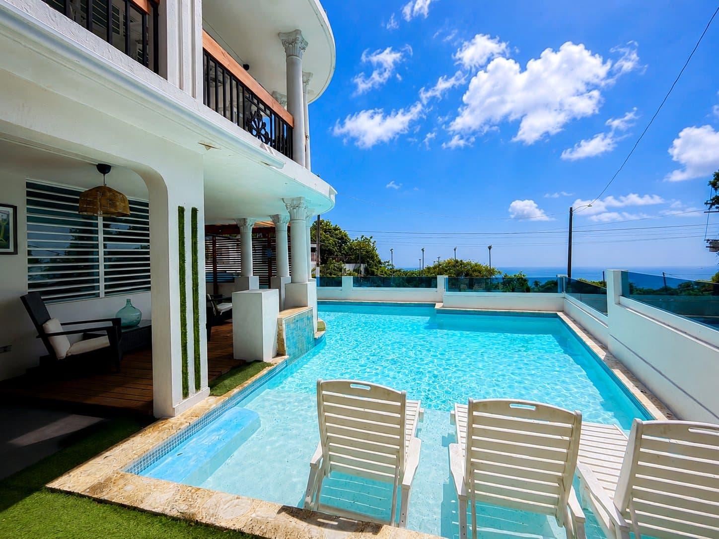 Pool with ocean-view loungers
